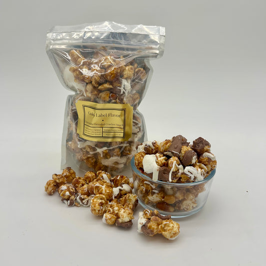 Homemade caramel corn and roasted Spanish peanuts drizzled with milk and white chocolate.