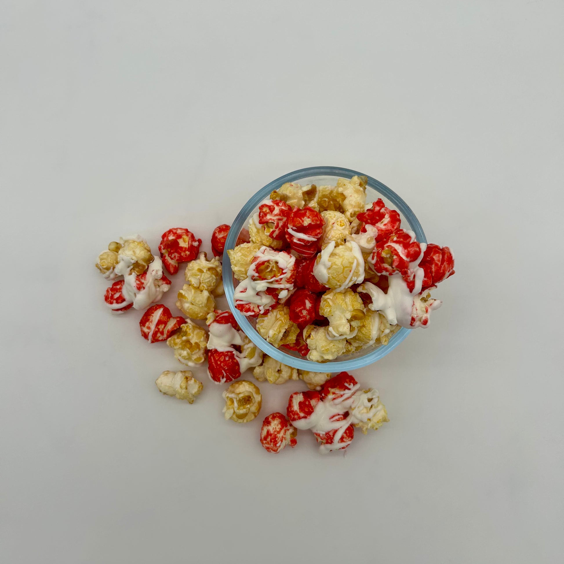 Strawberry popcorn and classic kettle corn, drizzled in white chocolate 