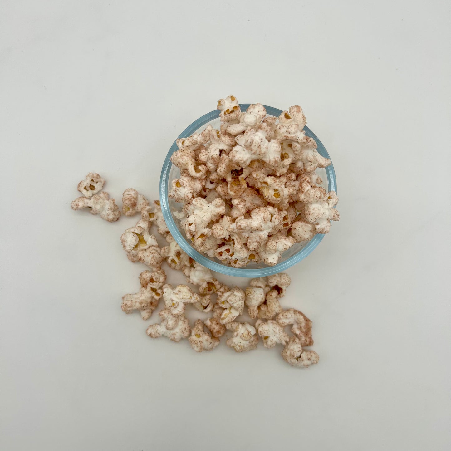 Sweet cinnamon sprinkled over light and fluffy kernels