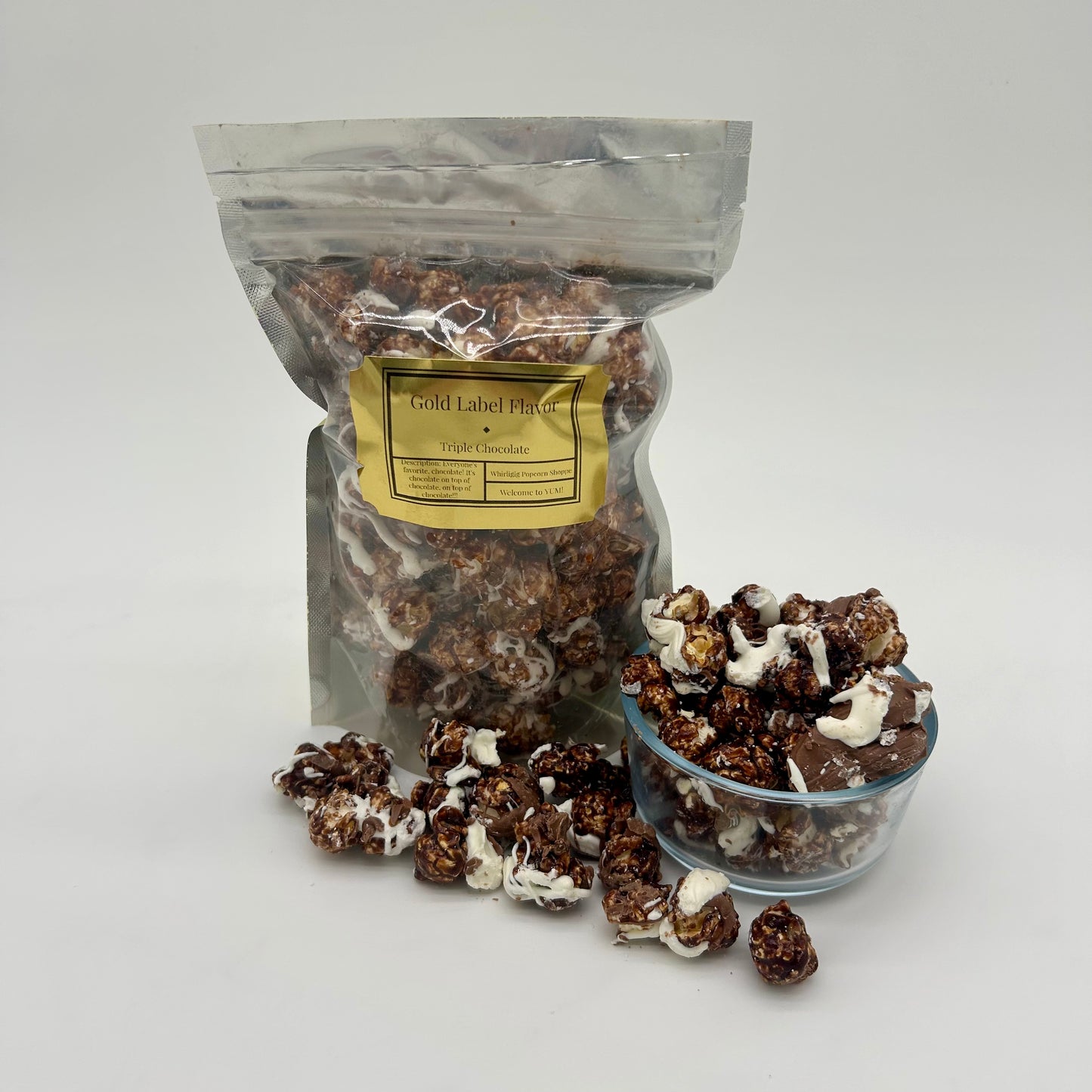 Chocolate coated popcorn drizzled with white and milk chocolate